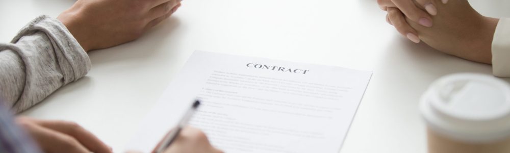 Man puts signature on mortgage investment contract for house rental purchase, couple buying insurance services, taking bank loan, making financial deal, customer sign document concept, close up view