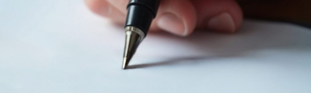 man-signing-document