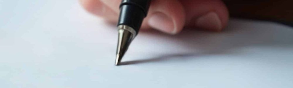 man-signing-document
