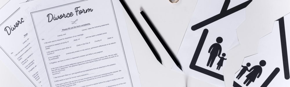 top-view-divorce-forms-with-house-keys-wedding-rings